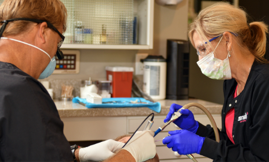 Dr. Ben Smith working on a patient's dentures in Wilmington, NC.
